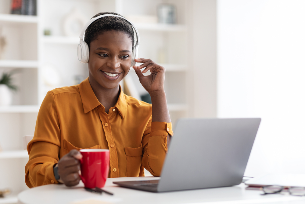 Woman with laptop learning English